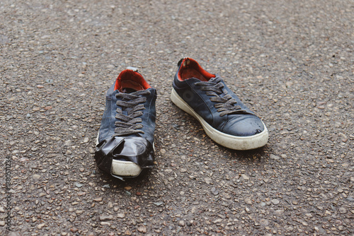 Vászonkép Duct Tape on Old Dirty Shoes