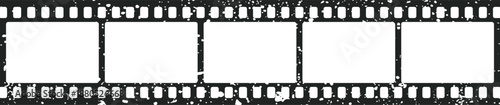 Blank grunge film strip template featuring four empty white frames with sprocket holes for creative overlays