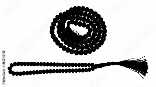 Black prayer beads with tassel used for meditation and spiritual practice.