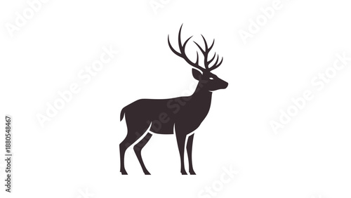 Silhouette of a majestic deer with large antlers standing calmly.