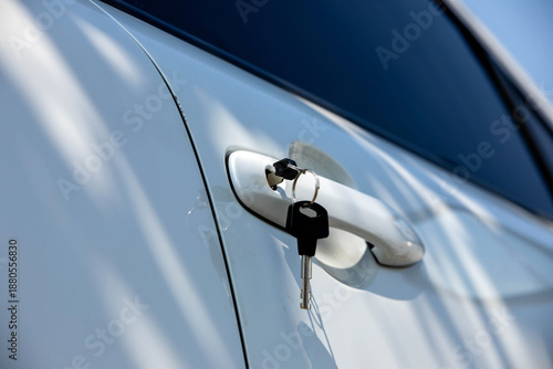 Car key left in the door lock, illustrating a common situation where the vehicle owner forgets the key and needs to unlock the car.