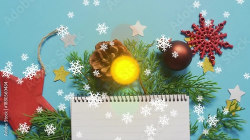 Snowflake drifting over flat lay then orbs appearing shifting stacking and pulsing above pine cone