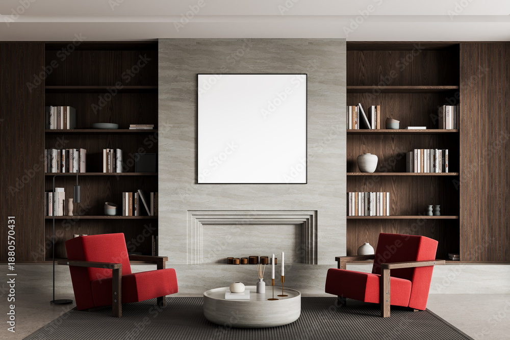 Naklejka premium Modern living room interior with blank framed poster on fireplace wall, red armchairs, wooden bookshelves and coffee table in elegant layout concept. 3D Rendering