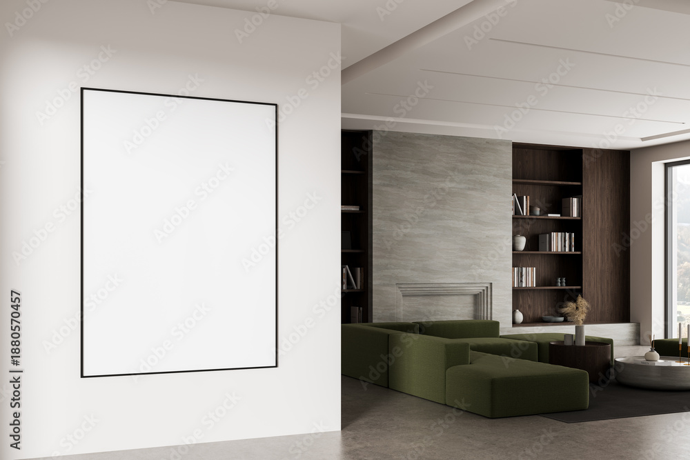 Fototapeta premium Minimalist interior with large blank poster frame on white wall and modern living room featuring green sofa, bookshelf, and stone textured fireplace wall. 3D Rendering