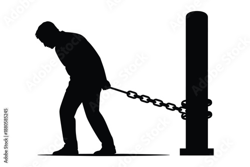 A man struggles with a heavy chain attached to a post