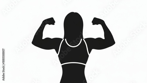 Strong woman flexing muscles in confident pose showing off power and strength fitness and empowerment