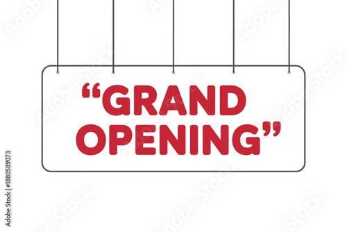A white sign with red grand opening text hanging on strings