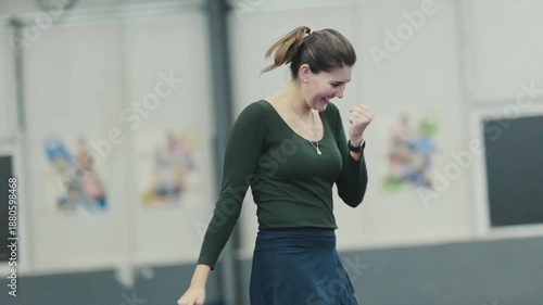 Happy woman celebrating scoring point playing table tennis