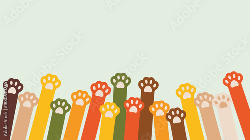Many colorful cat paws with cute paw pads are reaching upwards on a light green background