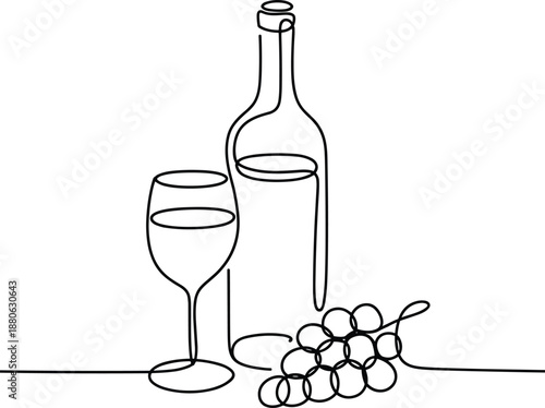 Wine bottle glass and grapes on a table wine glass