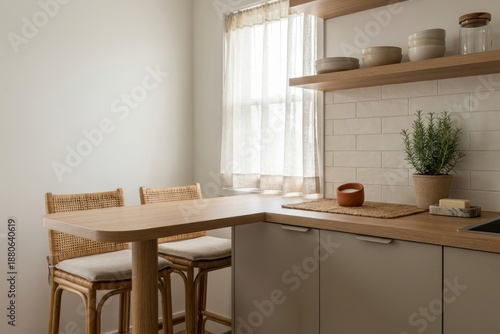 Small modern kitchen with wooden peninsula breakfast bar and stools