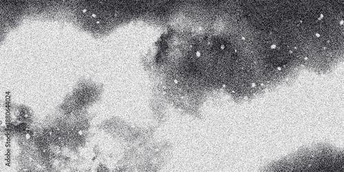 Abstract monochrome cloudy texture with a speckled, grainy effect and soft, diffused light creating a dreamlike or atmospheric visual for backgrounds and artistic projects