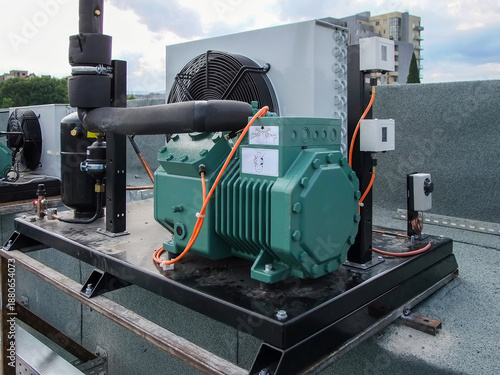 Complex industrial HVAC unit is mounted securely on a flat roof, showcasing its intricate system and design.
