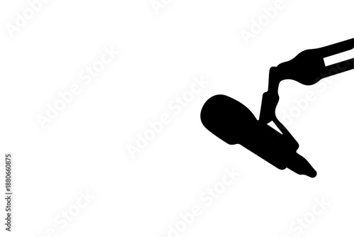 Black silhouette of a microphone on a stand on white background