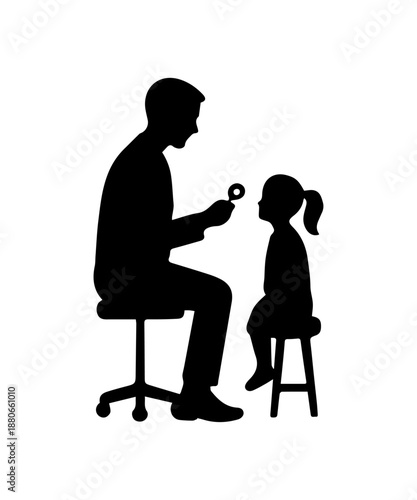 Optometrist checking child's vision for pediatric eye exam