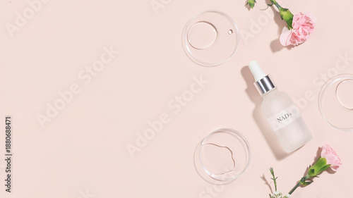 NAD Skincare Serum With Petri Dishes and Flowers on Light Pink Background. Concept Of Anti-Aging Beauty, Cellular Regeneration, Scientific Skincare, Longevity Rituals, And Clean Cosmetic Branding
