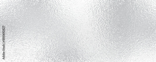 Dark gray silver texture background with a brushed metal effect, featuring a rough, grungy grain texture. It resembles stainless steel, perfect for a sleek, industrial look.