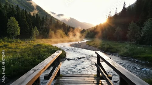 Wooden bridge spanning a misty mountain valley at sunrise, lush evergreen forest backdrop