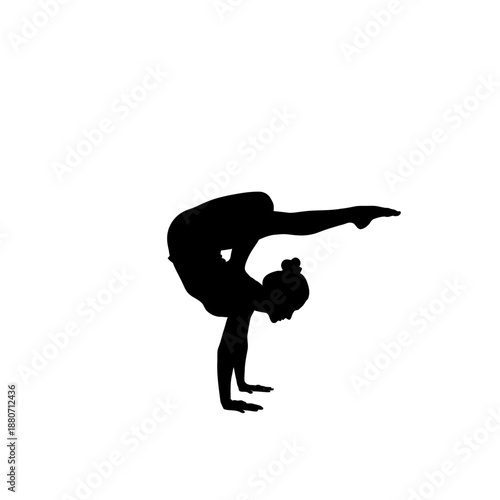 Silhouette of a gymnast performing a handstand scorpion pose.