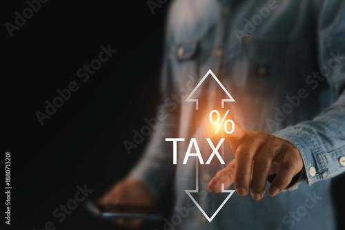 The concept of increasing or decreasing annual taxes, tax deduction trends, and government economic stimulus policies are all discussed, a man pointing to the virtual percentage icons on the screen.
