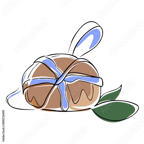 Decorative bun with blue icing and green leaves on white background  