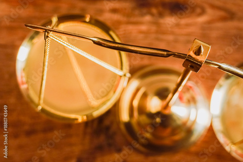  painting depicts the eyes of a lawyer adjusting the lens of justice in a law firm.