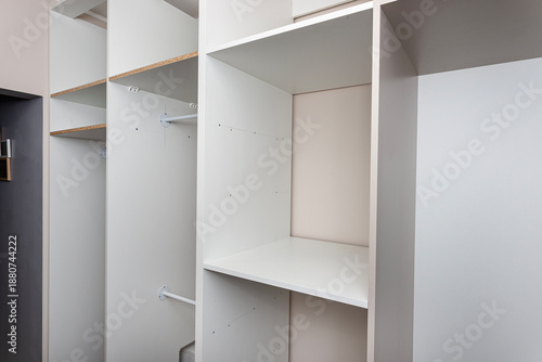 Wallpaper Mural A carpenter assembling a wardrobe in a vestibule, a precise handiwork. Torontodigital.ca