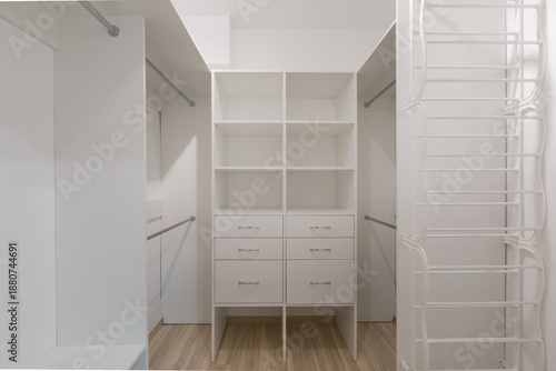 Canvas Print Minimalist Walk-In Closet Interior with White Built-In Wardrobe System, Open She