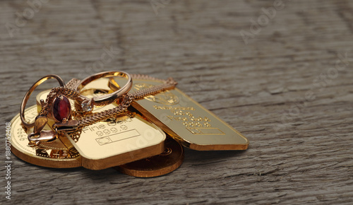 Gold bars and coins with jewelry on a wooden surface, symbolizing wealth, precious metals, luxury assets, investment value, financial security.