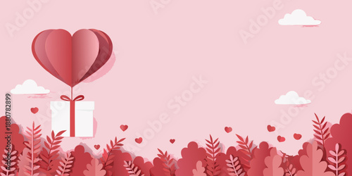 A paper heart balloon floats above a gift with a pink floral background