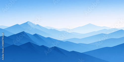 Majestic mountain landscape with mist and clouds over snowy peaks at sunrise in the alps valley under a blue morning sky dawn view