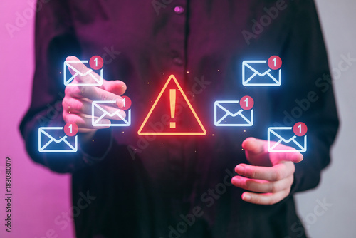 Person interacts with digital alerts about incoming emails in a modern setting during evening hours