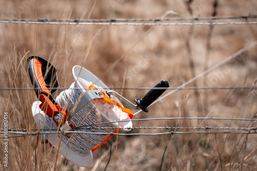 Fotografía Temporary electric fence with reels and polywire on a rotational grazing cattle