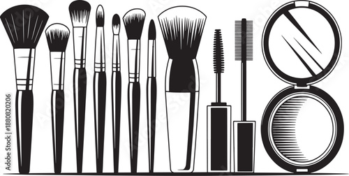 Black and white makeup brushes and tools arranged in a row with magnifying glass