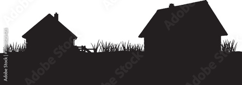 Silhouette of two houses and grass with a fence buildings