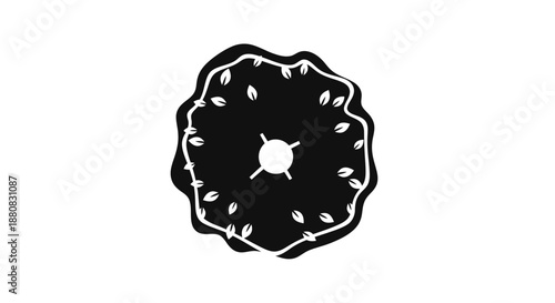 Black donut with white seeds.