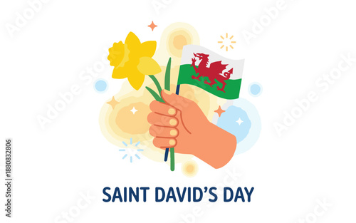 Hand holding Welsh flag and daffodil for Saint David's Day