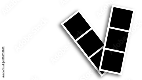 Εκτύπωση καμβά Two white photo booth strips with empty frames against dark background