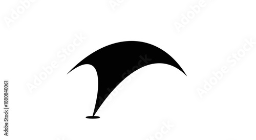 Black hang glider silhouette flying high.