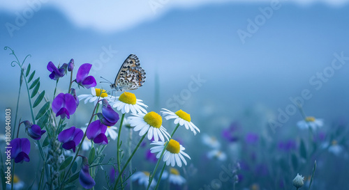 Butterfly on colorful flowers in a serene mountain meadow scene © lemah biru
