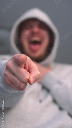 Humiliation and bullying.
Mocking and humiliation.
A person insults someone and makes fun of them.
An angry man mocks and looks at the person he insulted with contempt.