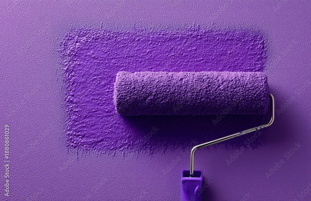 Obraz premium Paint roller with purple paint swatch on textured wall