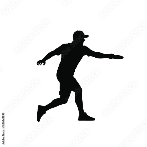 Man in black silhouette running and throwing a frisbee