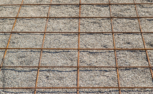 Knitting metal reinforcement for a swimming pool. Selective focus.