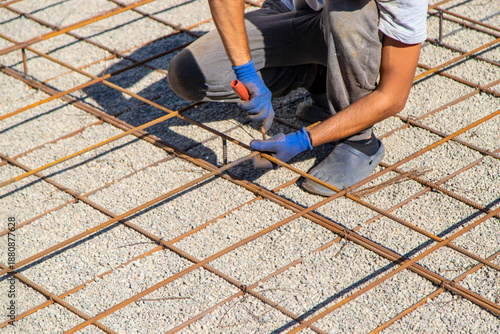 Knitting metal reinforcement for a swimming pool. Selective focus.