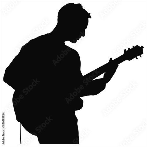 Silhouette of man playing electric guitar
