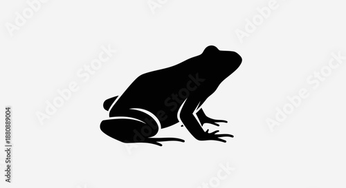 Black silhouette of a sitting frog.