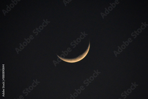 Glowing White Crescent Moon in a Clear Dark Night Sky