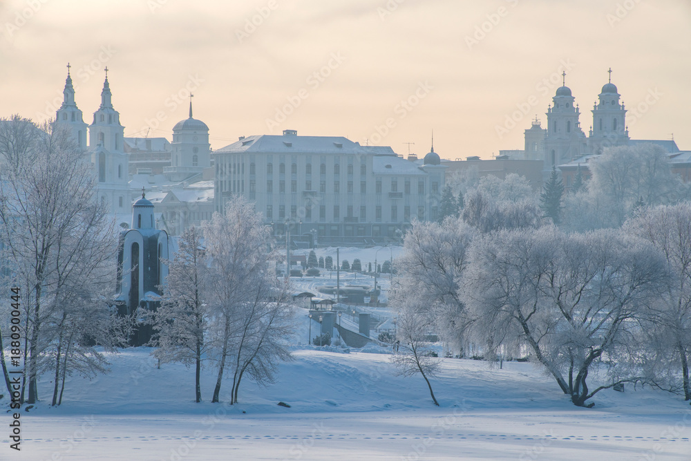 Obraz premium The city of Minsk is covered in snow in winter.
