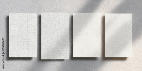 Four blank cards with shadows show different paper textures on a neutral background